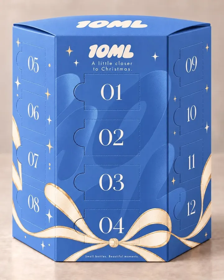 The 10ML perfume advent calendar for him: a hexagonal box with 24 numbered doors, tied with a ribbon
